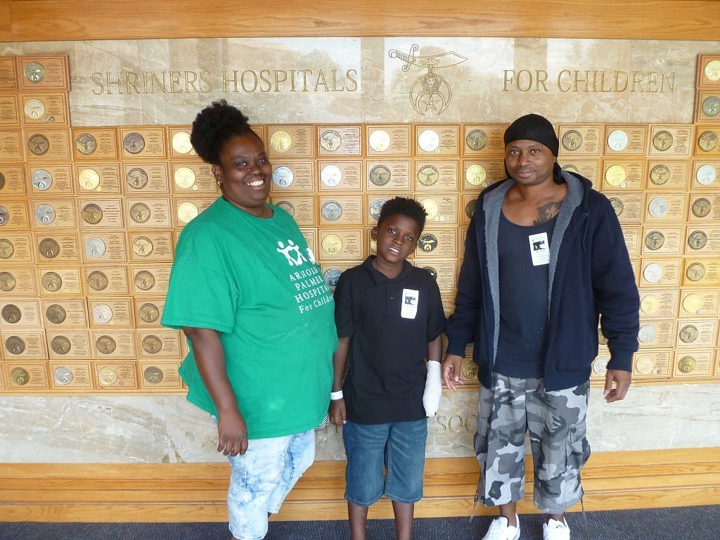 Fazion Brown (middle) with his parents at the Shriners Hospitals for Children in Tampa. Photo courtesy of the Flagler County Sheriff's Office