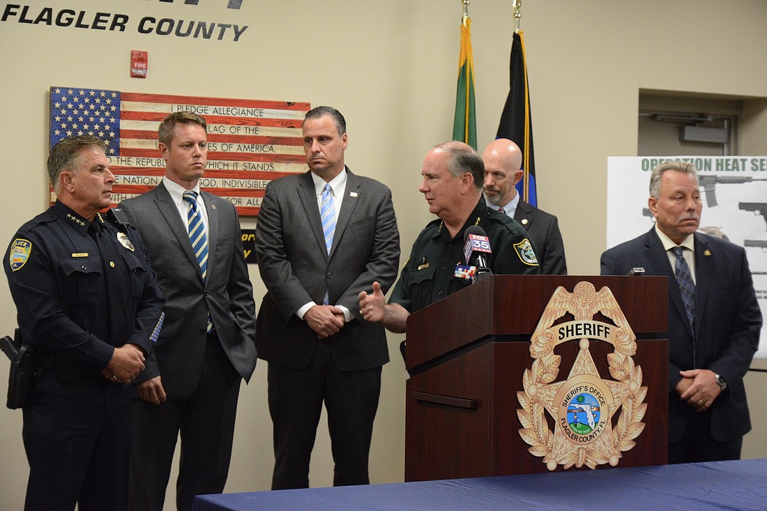 Sheriff Rick Staly turns to Bunnell Police Chief Tom Foster during a Sept. 29 news conference. Photo by Jonathan Simmons