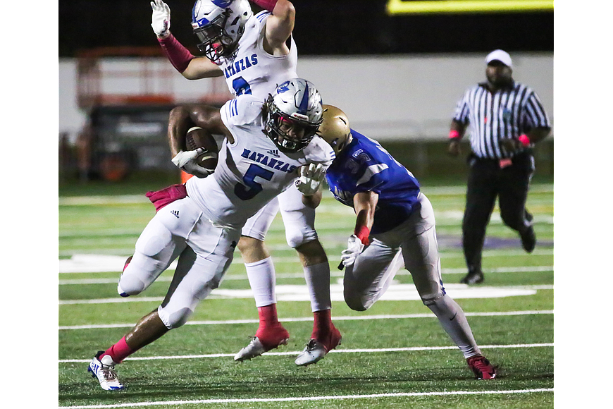 Matanzas' Tylee Austin swerves in an attempt to avoid a tackle. Photo by Paige Wilson
