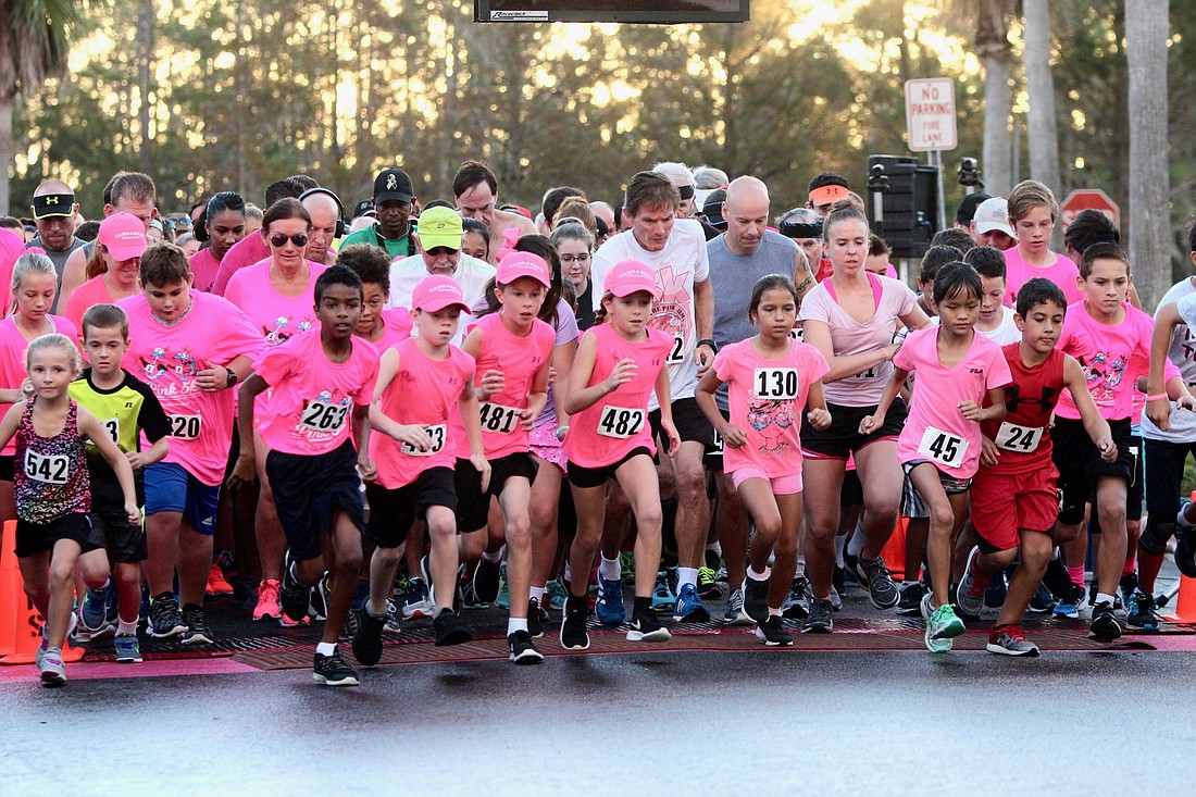 Participants in the Pink 5K at Florida Hospital Flagler take off at the start of the race. Photo by Ray Boone