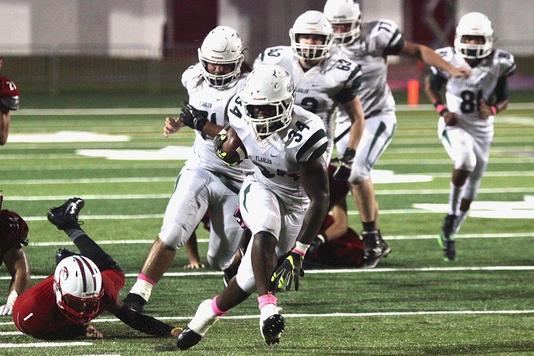 FPC's Marc Genis runs the ball in the third quarter against Seabreeze. Photo by Ray Boone