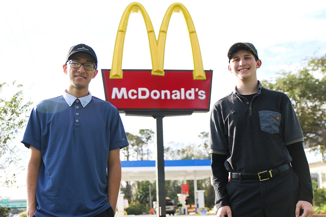 Victor Marcano, who works at the Flagler Beach McDonald's, and Roy Taylor, who works at the US 1 Ormond Beach location, are thankful for the business' Archways to Opportunity program. Photo by Paige Wilson