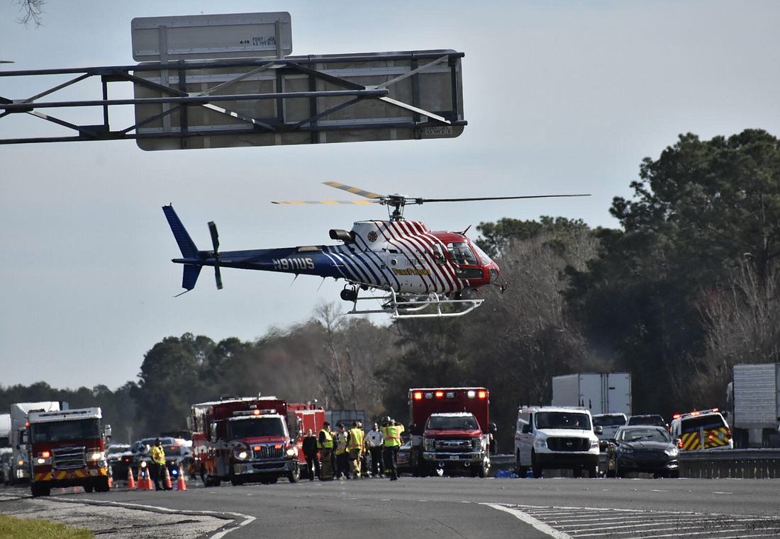 An emergency helicopter lands on I-95 after a deadly car crash. Courtesy photo