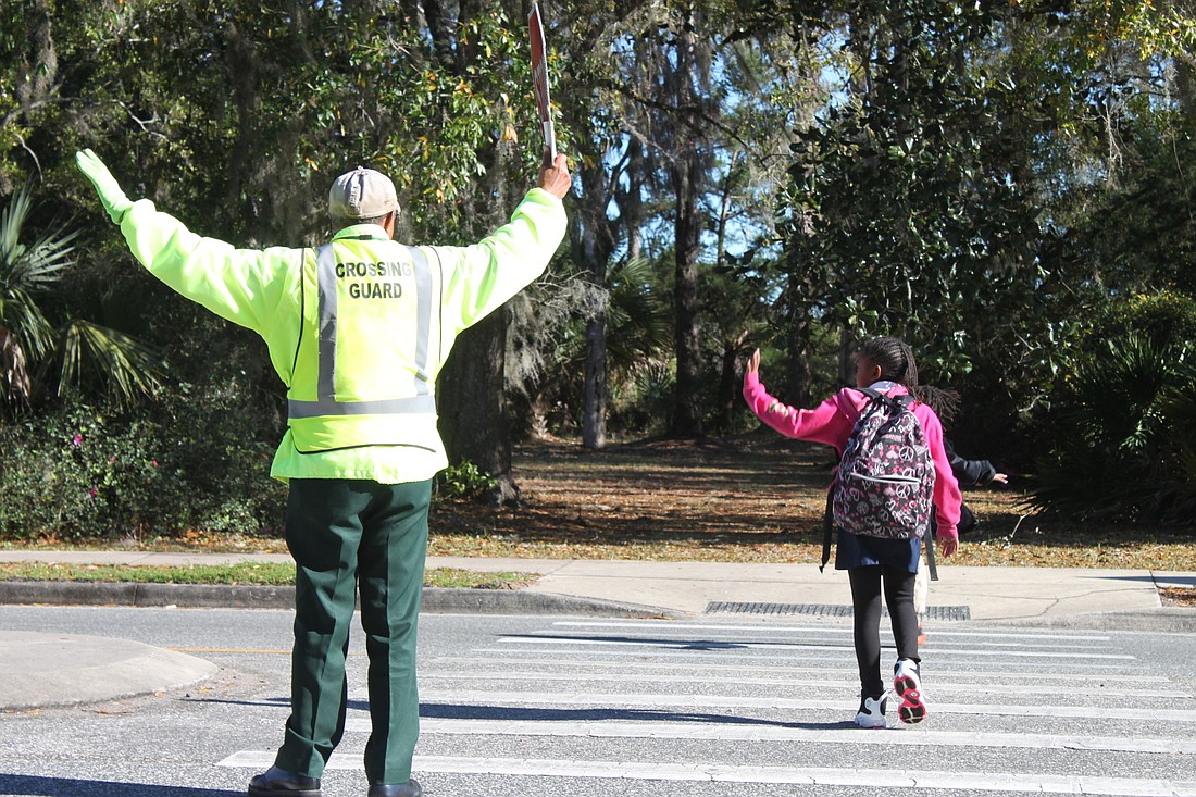Crossing guard Jack Conwell can be seen every school day on State Road 100, helping children get to Bunnell Elementary safely. (Photo courtesy of the Flagler County Sheriff's Office.)