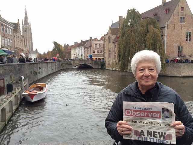 Barbara Guinta with her Palm Coast Observer in Amsterdam. Courtesy photo
