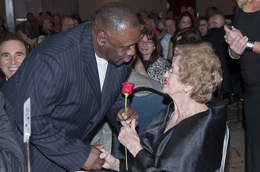 Frankie Sanders exchanges a rose for a hug from Betty