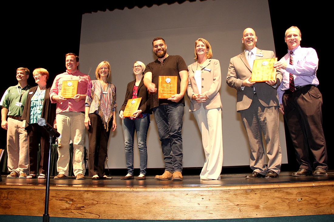 Art Hall of Fame induction at the Flagler Auditorium. Left to right: Trevor Tucker, Ann DeLucia, Sean Palmer, Janet Mac Donald, Christina Katsolis, A.J. Neste, Colleen Conklin, Jacob Oliva, and Edson Beckett. Photo by Jacque Estes