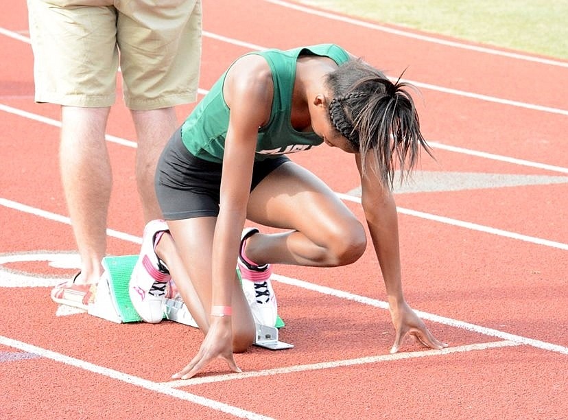 Namiah Simpson got comfortable in her blocks before taking third in the 400-meter run. Photo by Erakal Goodman