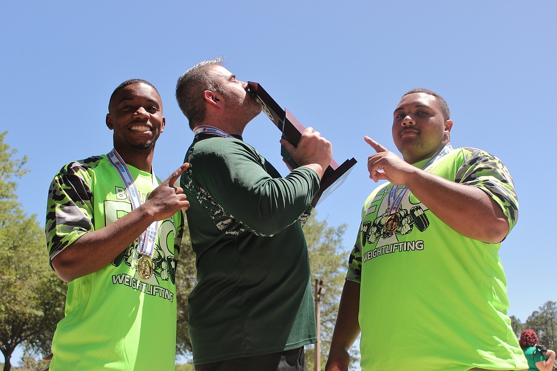 Kendrick Thomas, coach Duane Hagstrom and Mike Astro. Photo by Jeff Dawsey