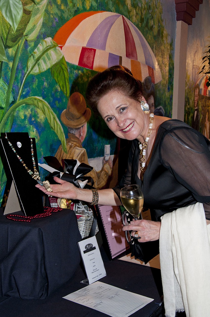 Flora Major bidding in the silent auction