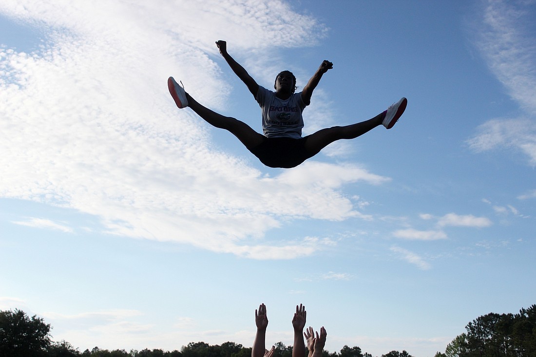 Ti'erria Robinson performs a toe-touch basket at practice. Photo by Jeff Dawsey