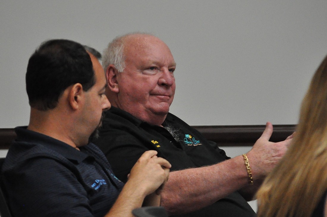City Councilman Jason DeLorenzo, left, listens as Palm Coast Mayor Jon Netts speaks at an April 26 City Council workshop. (Photo by Jonathan Simmons)