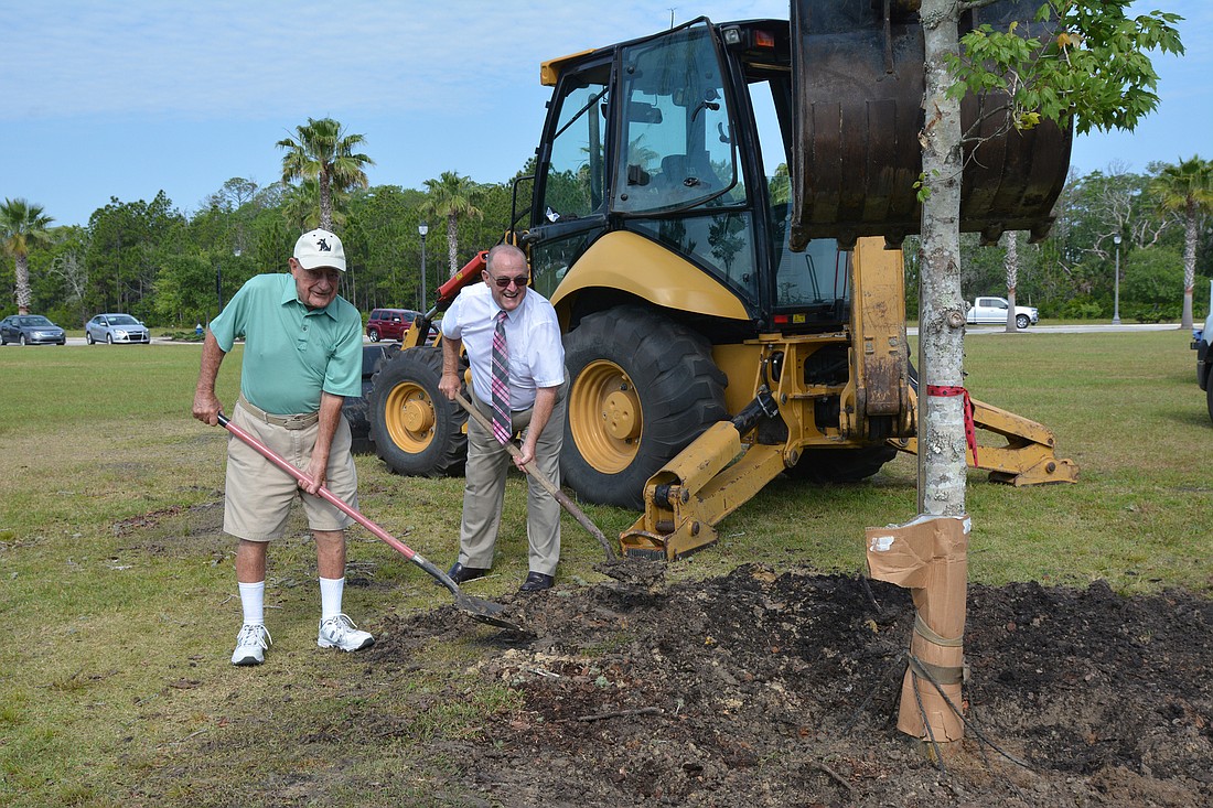 Committee Chair, for the planting ceremony, Bob Tabit and Palm Coast Garden's Club President Tom McKean. Photos by Lisa Wolfe