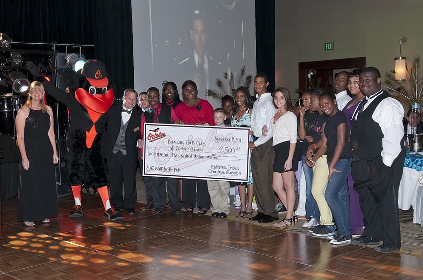 The Orioles hand over a check for $2,500.00