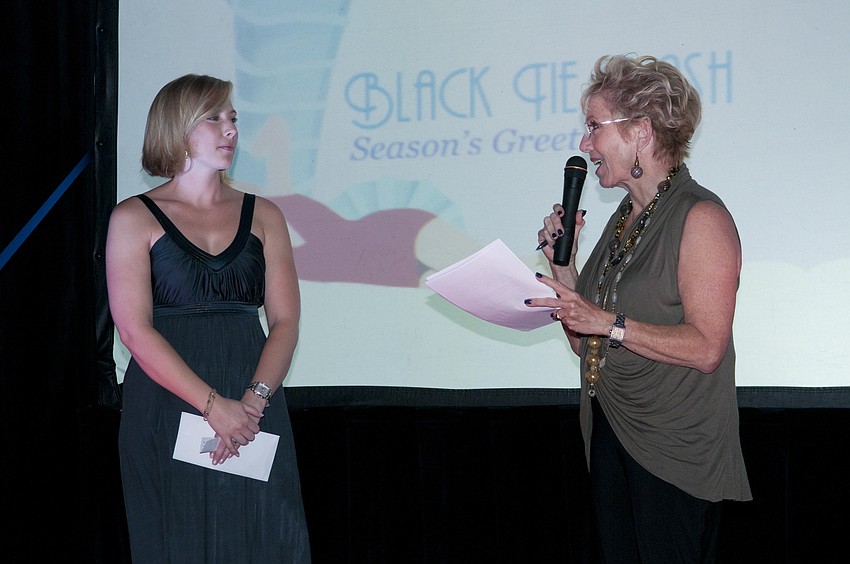 Observer Advertising Coordinator Stephanie Hannum being thanked by Black Tie Editor Molly Schechter