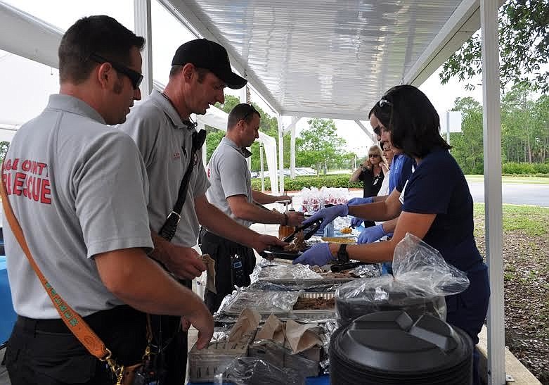 Flagler emergency personnel enjoy lunch by the ER entrance to Florida Hospital Flagler. Courtesy photo