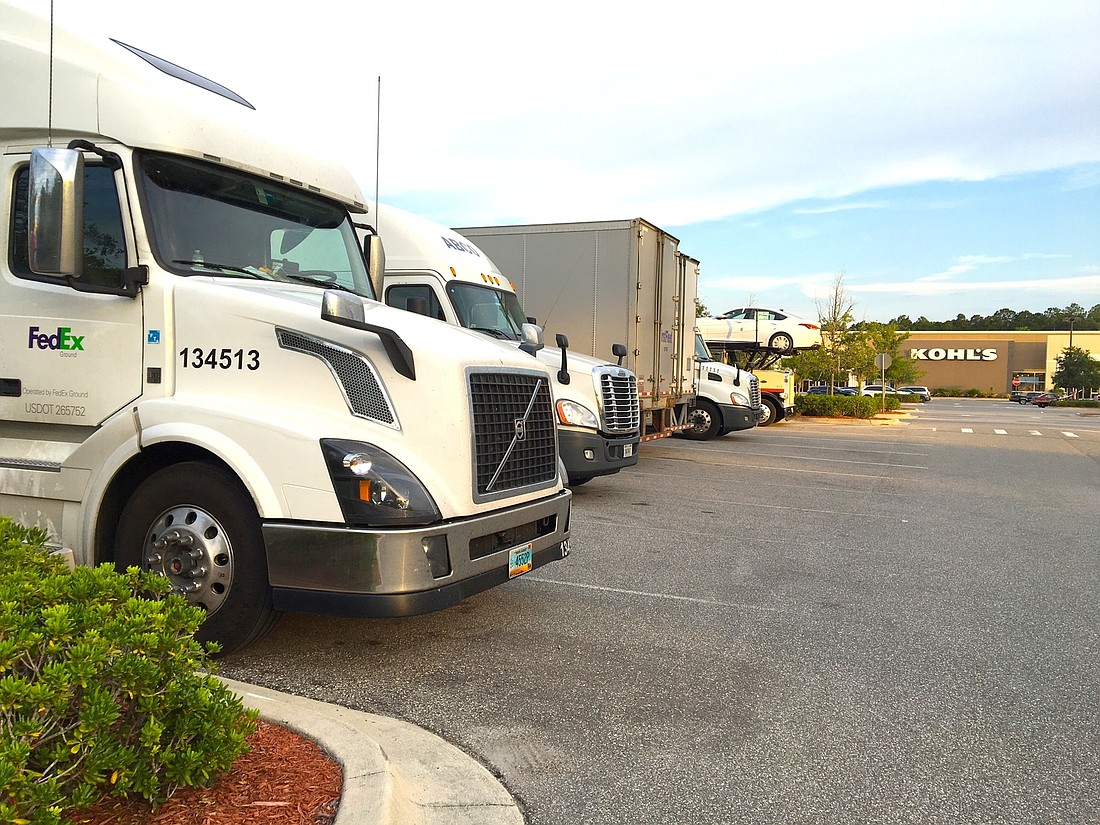 The city of Palm Coast counted 14 trucks at one time in the Kohl's parking lot, which is not allowed; the property is zoned for retail, not truck storage. Photo by Brian McMillan