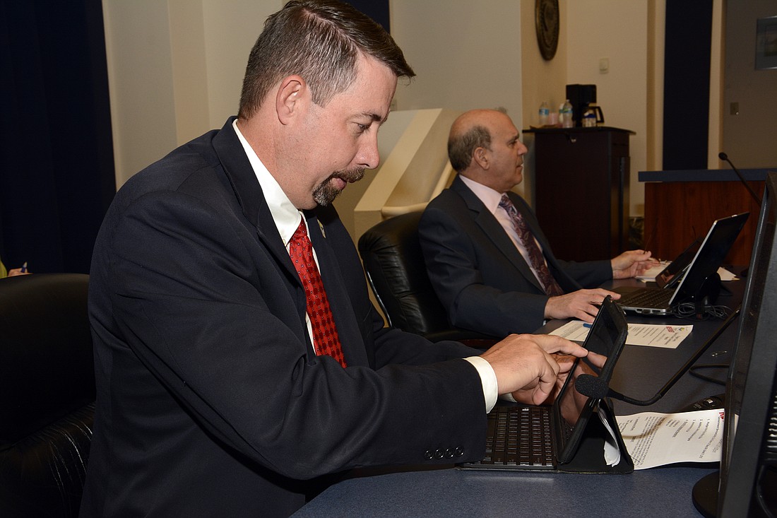 County Administrator Craig Coffey and County Attorney Al Hadeed during a County Commission meeting. (File photo)
