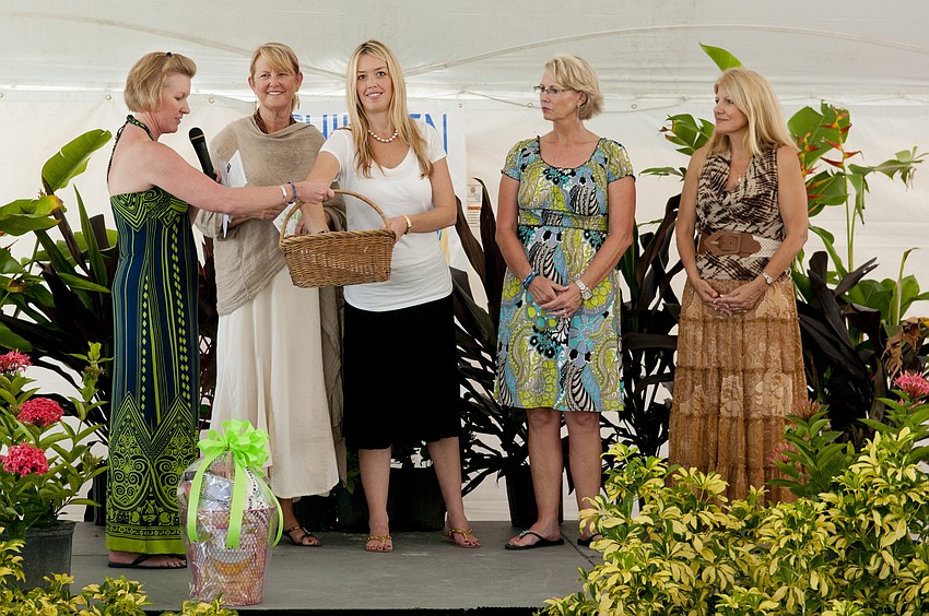 Angie Stringer with co-chairs drawing the raffle