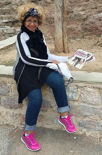 Loyce Allen reads her Palm Coast Observer on vacation. Courtesy photo