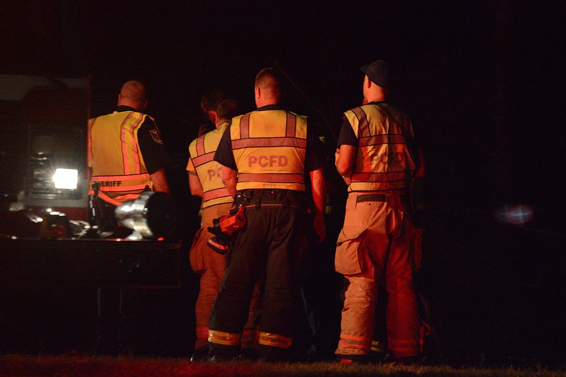 First responders gathered at the site of a fatal car crash the evening of Jan. 16. (Photo by Jonathan Simmons)