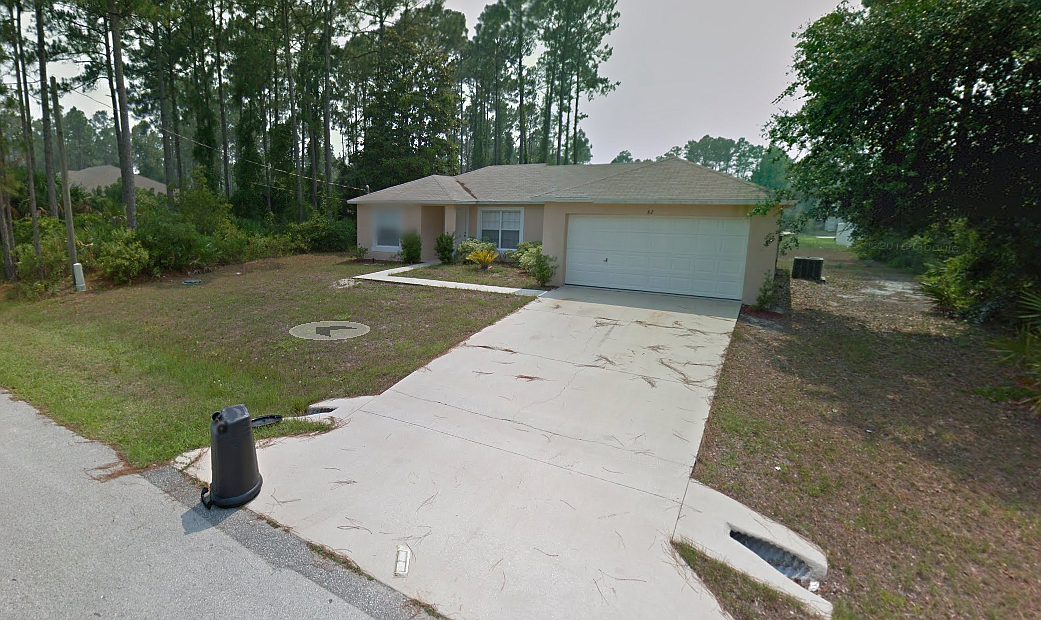 Investigators seized an AR-15 rifle, three handguns and $20,000 in drugs from this home on Port Royal Drive in Palm Coast. (Image from Google Maps)