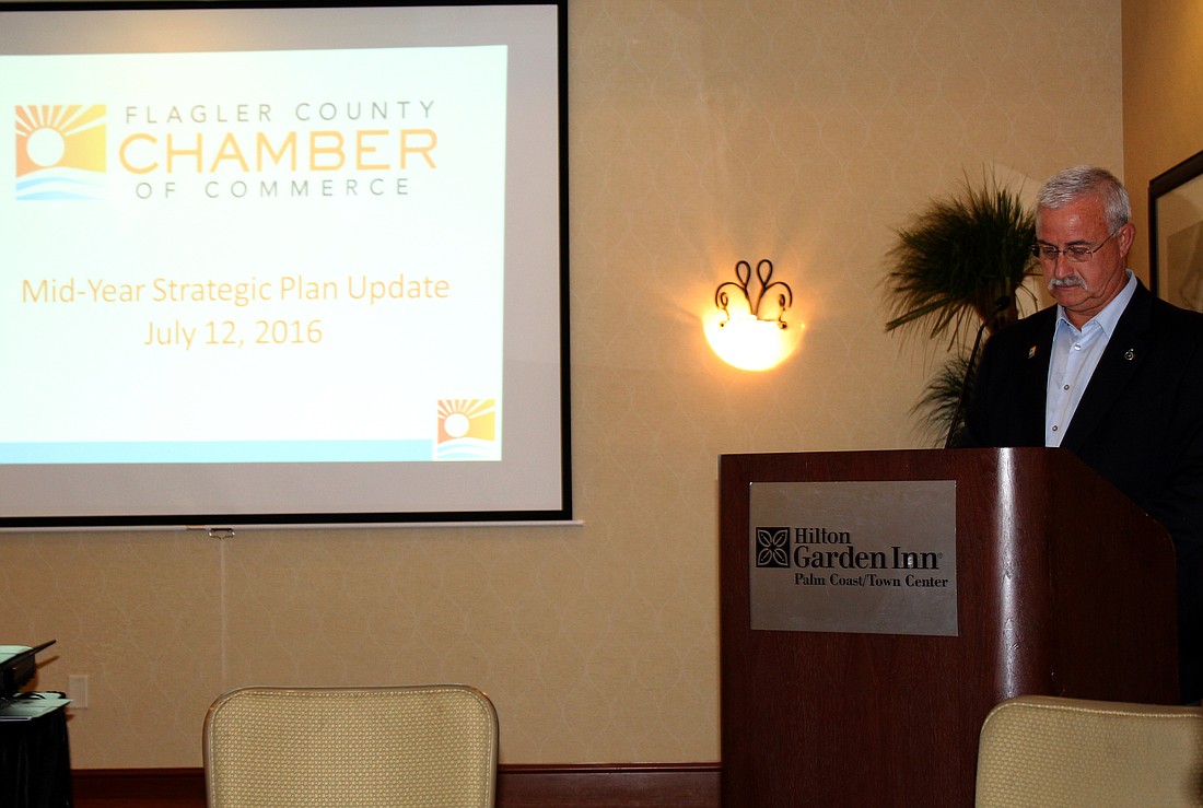 Flagler County Chamber of Commerce Board Chair Rich Stanfield stands at the podium prior to the start of Tuesday's Membership meeting. Photo by Jacque Estes