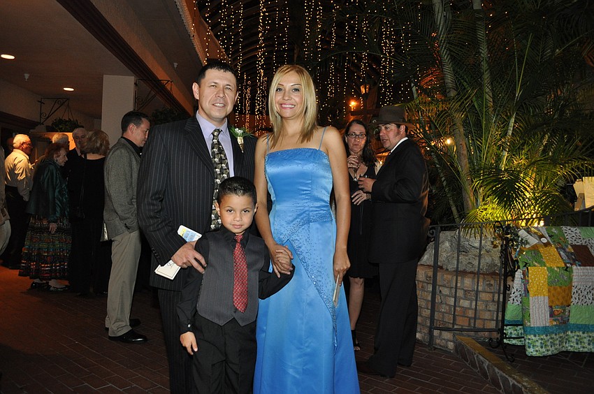 Honored veterinarian Dr. Gilberto Corona, Graciela and Christopher