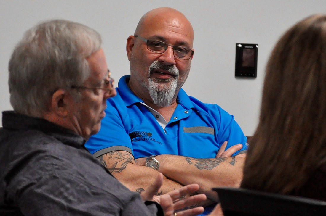 City Councilman Steve Nobile, center, listens as Councilman Bill McGuire, at left, speaks during a City Council workshop. (File photo)