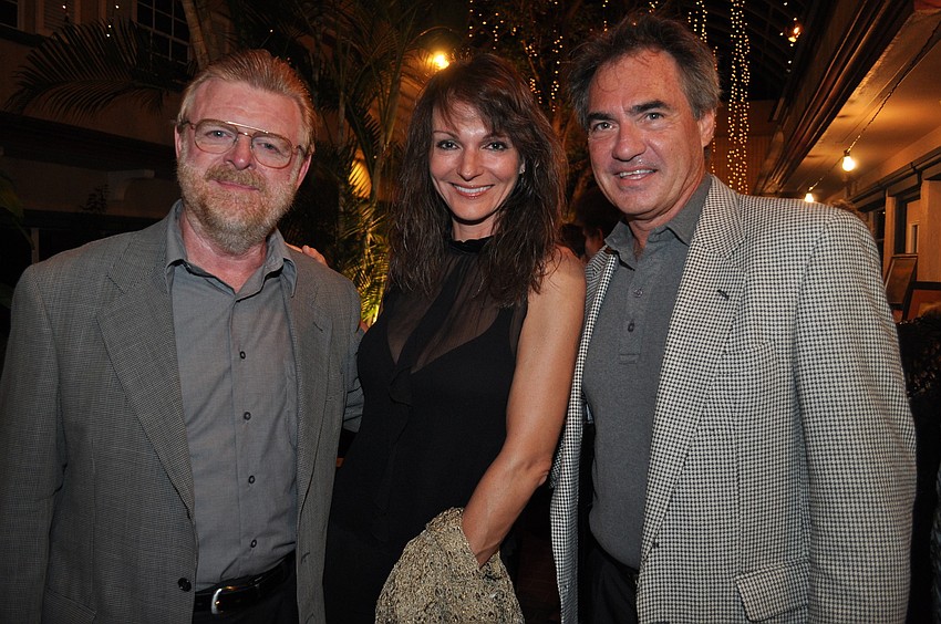 Charles Hamilton, honored veterinarian Dr. Anne Chauvet and David Deacy