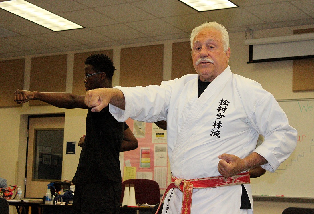 George Alexander demonstrates various karate techniques to students in the Bring you A Game program at Buddy Taylor Middle School. Photo by Jeff Dawsey