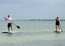 "We figured it would be better to try it here than in Seattle," said Simon Gaunt about why he and Susan Gaunt decided to try out paddleboarding.