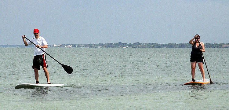"We figured it would be better to try it here than in Seattle," said Simon Gaunt about why he and Susan Gaunt decided to try out paddleboarding.