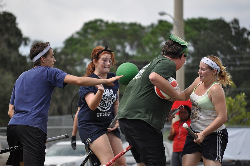 Students at the Ringling College of Art and Design and the University of South Florida fight for the ball.
