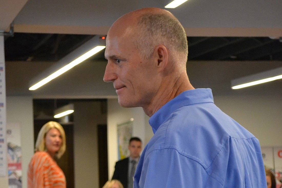 Florida Gov. Rick Scott shook hands with Observer Group employees this morning.