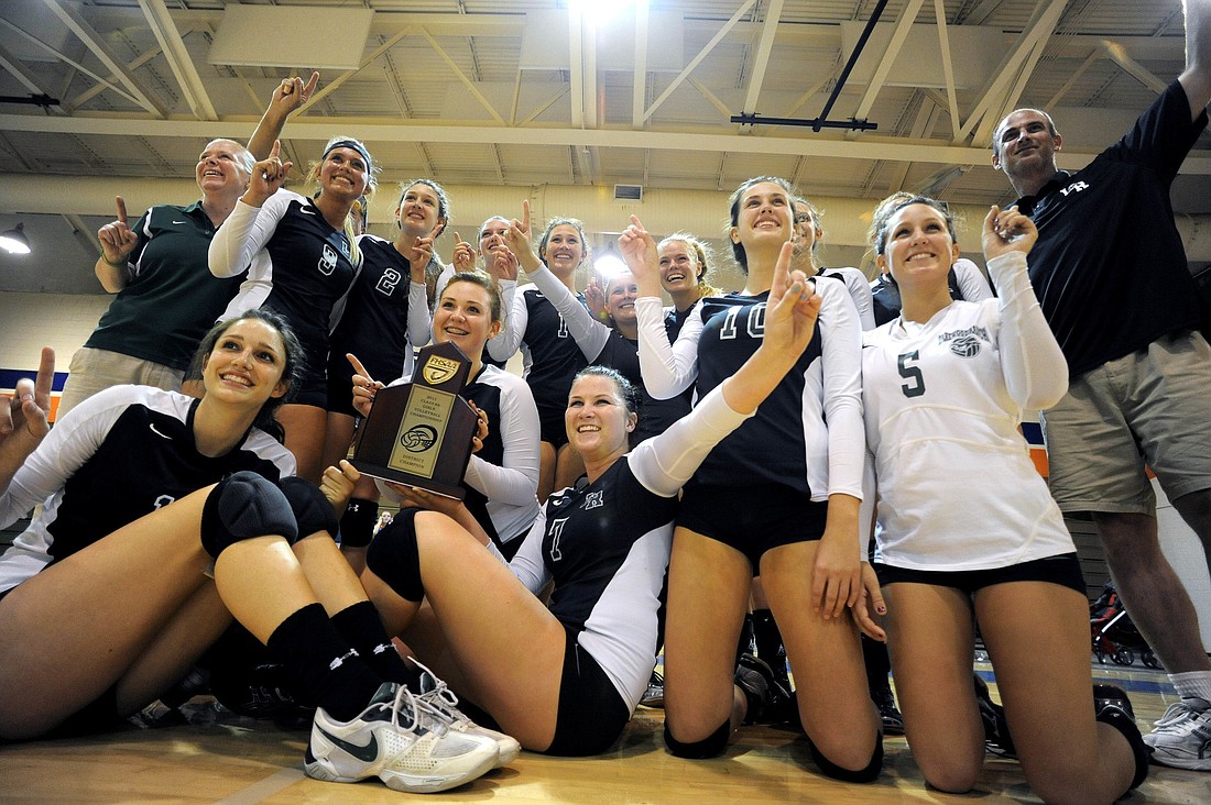 The Lakewood Ranch volleyball team celebrates after defeating second-seeded Seminole Osceola 3-1 Oct. 27 to win the school's first district crown.