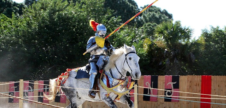 A jouster makes his way towards his opponent during a jousting tournament, Sunday, Nov. 13, at the Sarasota Medieval Fair.