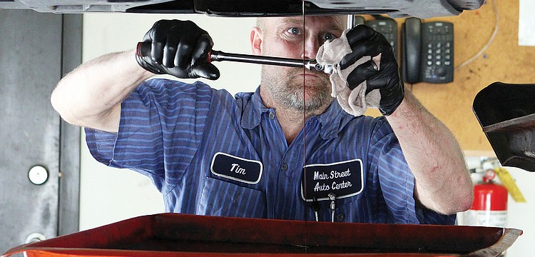 Tim Esser has worked as a mechanic for 26 years and has been with Main Street Automotive for 13 years. "(I enjoy) making people happy and helping people," he says.