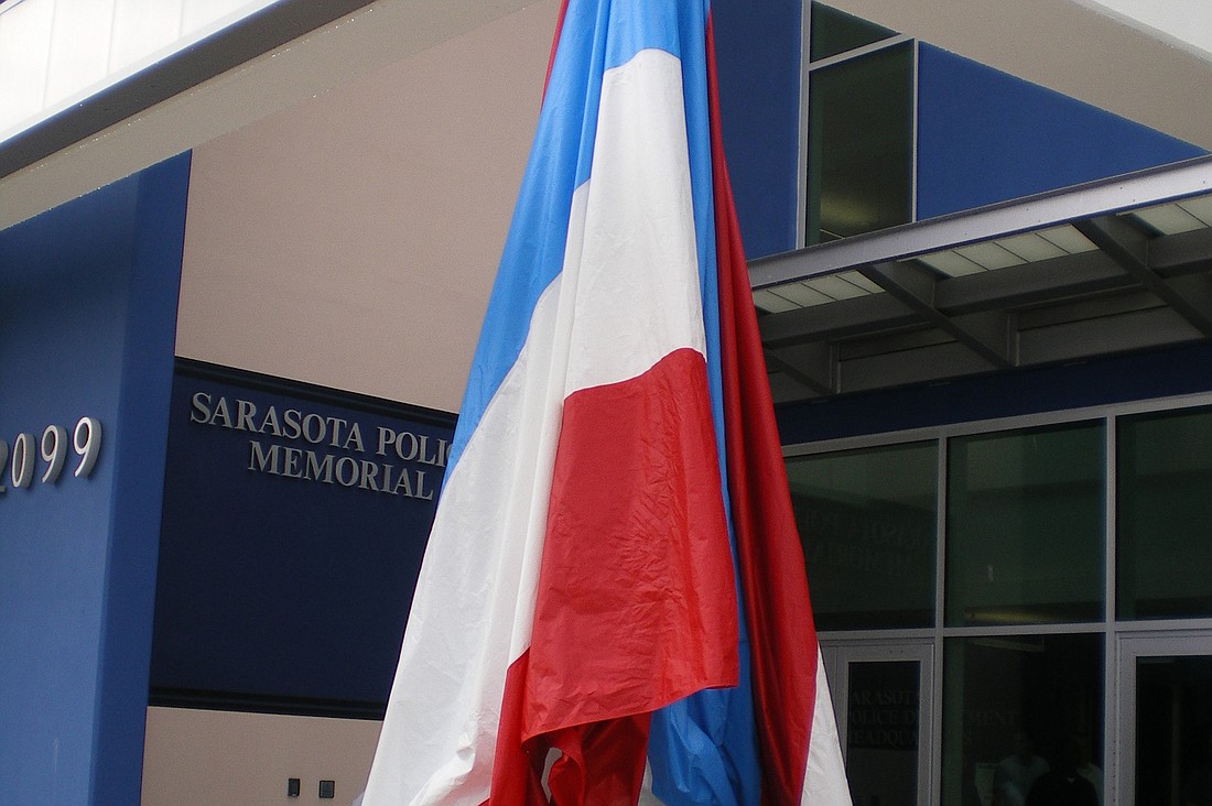 The World Trade Center artifact was erected in front of the Sarasota Police Department Monday, then covered with a red, white and blue tarp. It will be unveiled during a Sept. 11 ceremony. Photo courtesy of Norman Schimmel.