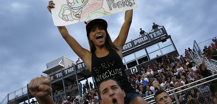 Sarah Kinsey got a boost from a classmate so she could cheer on the Pirates from above.