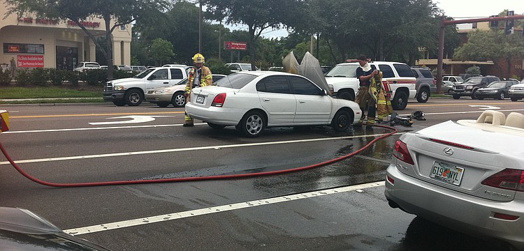 A car caught on fire at the intersection of Bahia Vista and U.S. 41, slowing traffic Thursday afternoon.