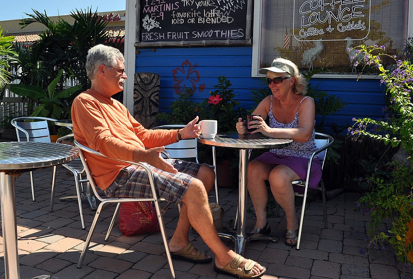 Mike and Janice Quinn enjoy a cup of coffee at LeLu Coffee Lounge before enjoying a day on the Key. The Quinns are on a six-week vacation from Leicestershire, England.