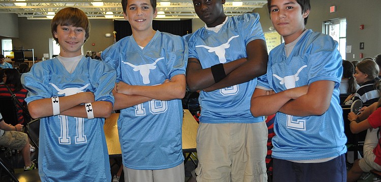 Josh Schultz, Ronny Hinton, Stevenson Villarson Damas and Jayson Bardales donned their football jerseys for the pep rally.