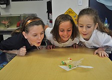 Gillette Bauer, Susan Pacer and Sofia Mascorro send their Life Savers race car zooming across a table.