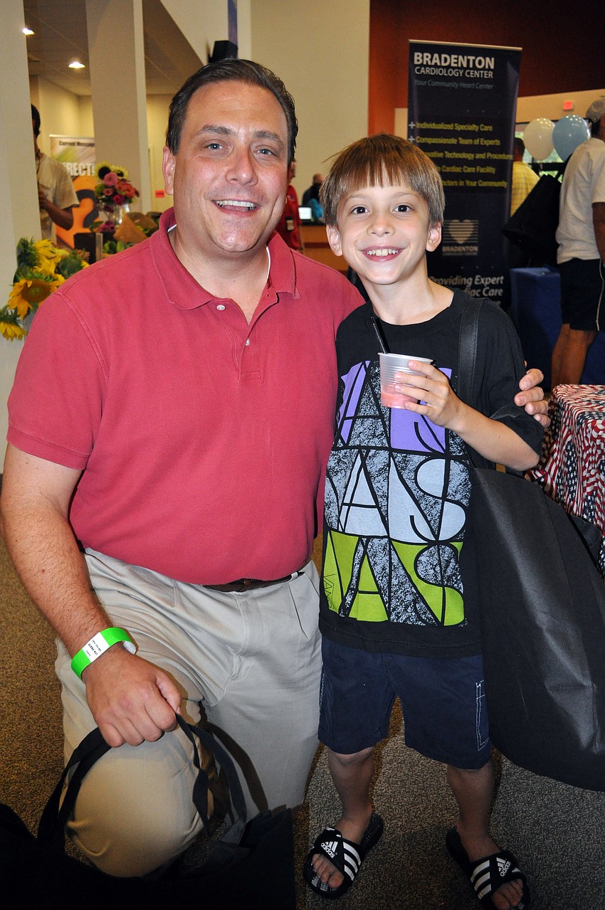 William Wolf and his 9-year-old son, Tim, attend Woodland, the Community Church.