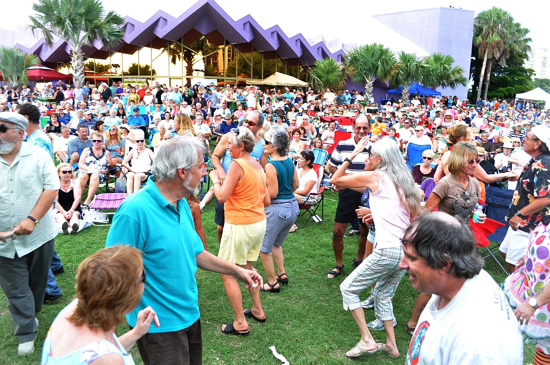 People love to get up and dance to the musicians at Friday Fest on the Bay.
