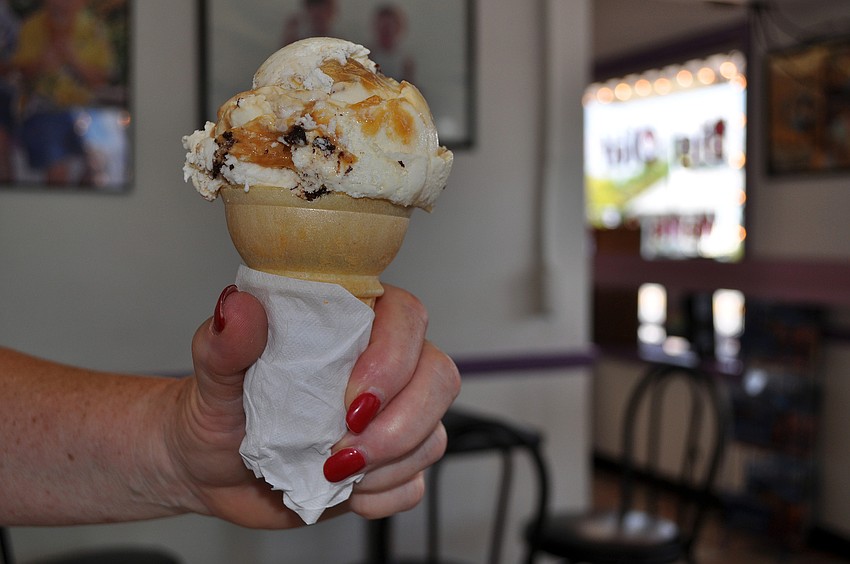 Karen Abraham holds her ice cream cone of Big Olaf's vanilla with brownies and a caramel swirl.