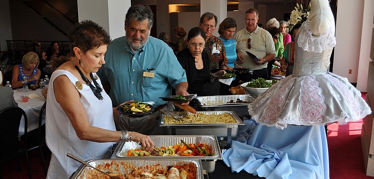 People go through the buffet put together by Word of Mouth catering Friday, Sept. 16, for the Ballet and Buffet event at the FSU Center for the Performing Arts.