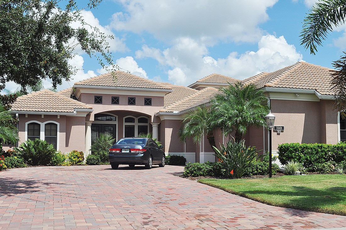 This Lakewood Ranch Golf and Country Club home, which has four bedrooms, four baths, a pool and 3,738 square feet of living area, sold for $570,000. Photo by Pam Eubanks.