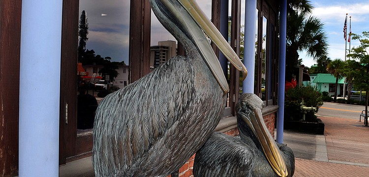 Where is this pelican statue on Siesta Key?